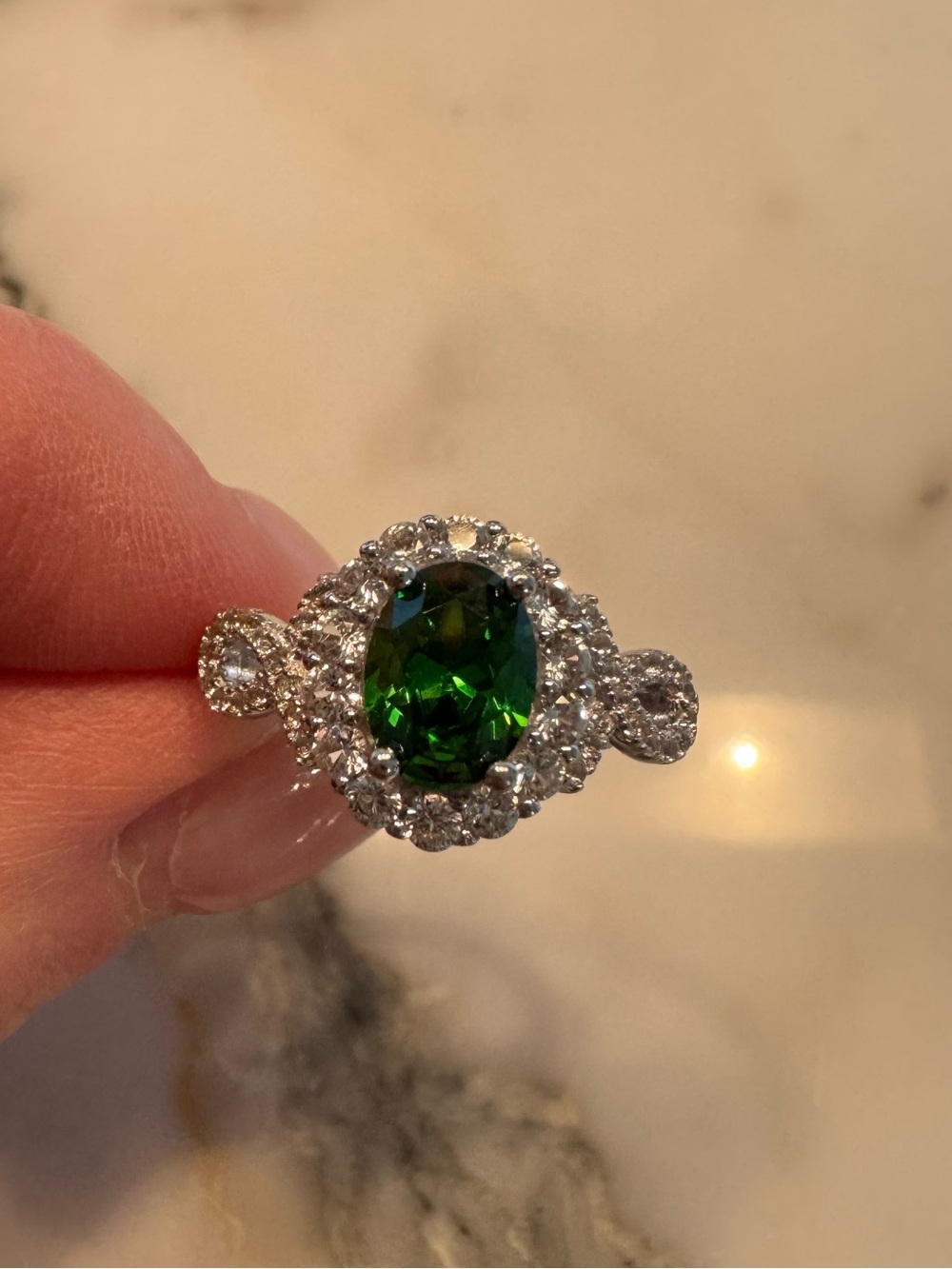 Women's Sterling Silver Ring with Emerald Oval Center Stone and Halo